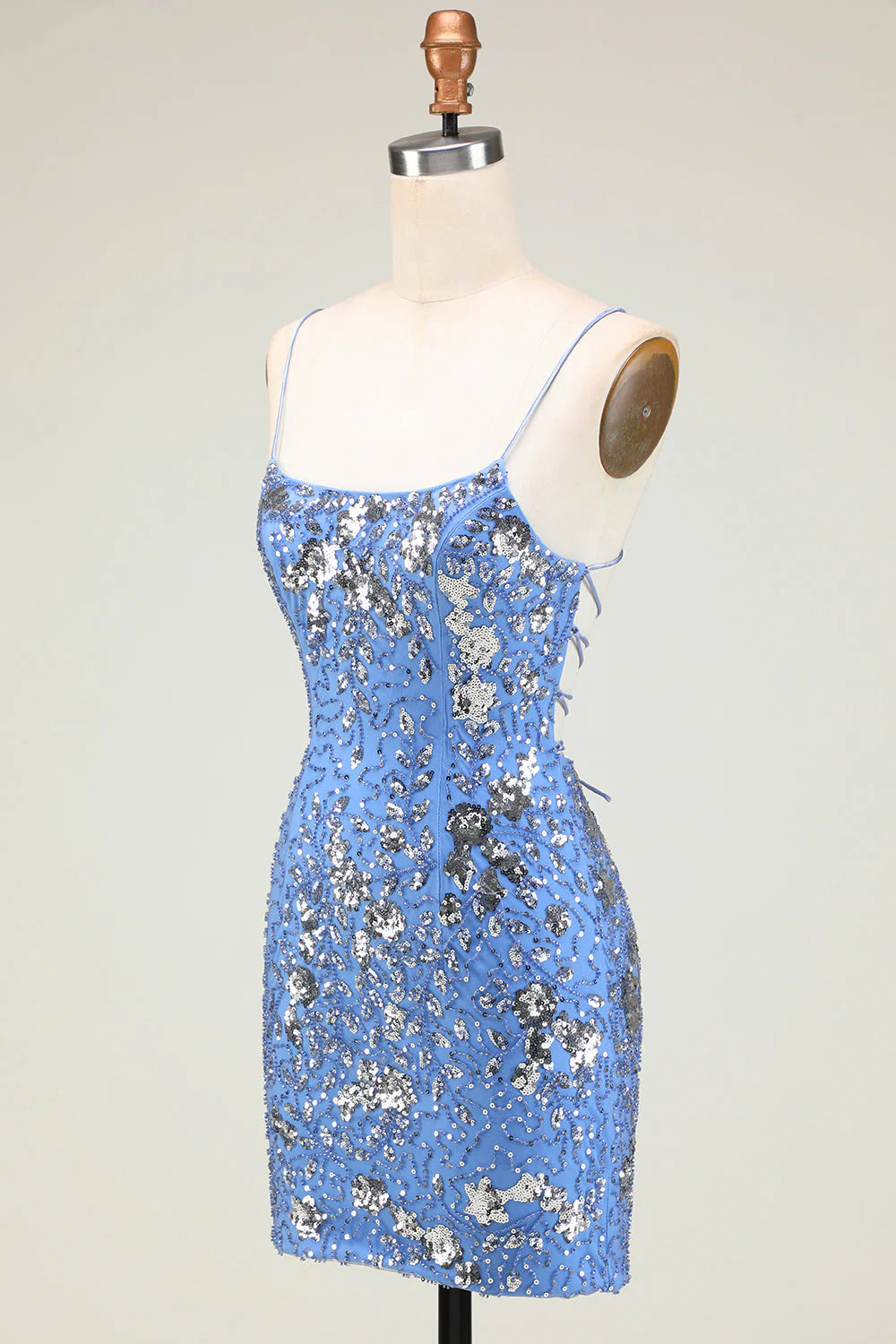 Side view of a shimmering grey blue sequin sheath dress.