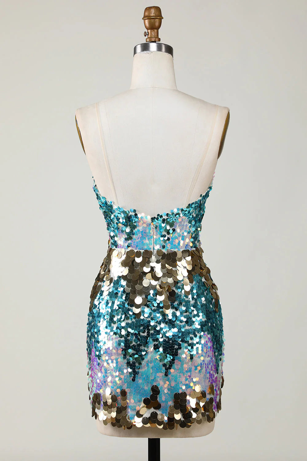 Model wearing a sparkly blue sequin short homecoming dress, side view.