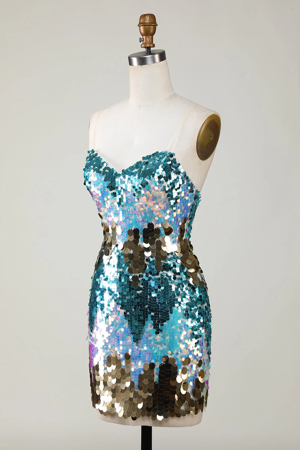 Close-up of the sparkly blue sequin fabric on a short dress.