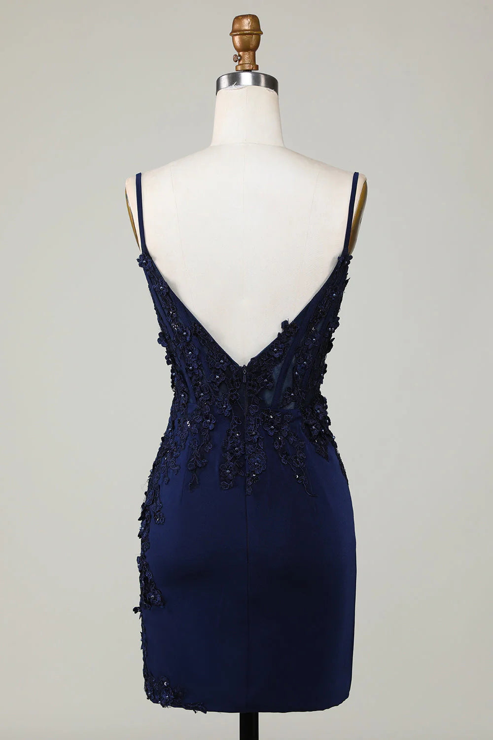 Back view of the sparkly navy corset homecoming dress, showing lace and fitted silhouette.