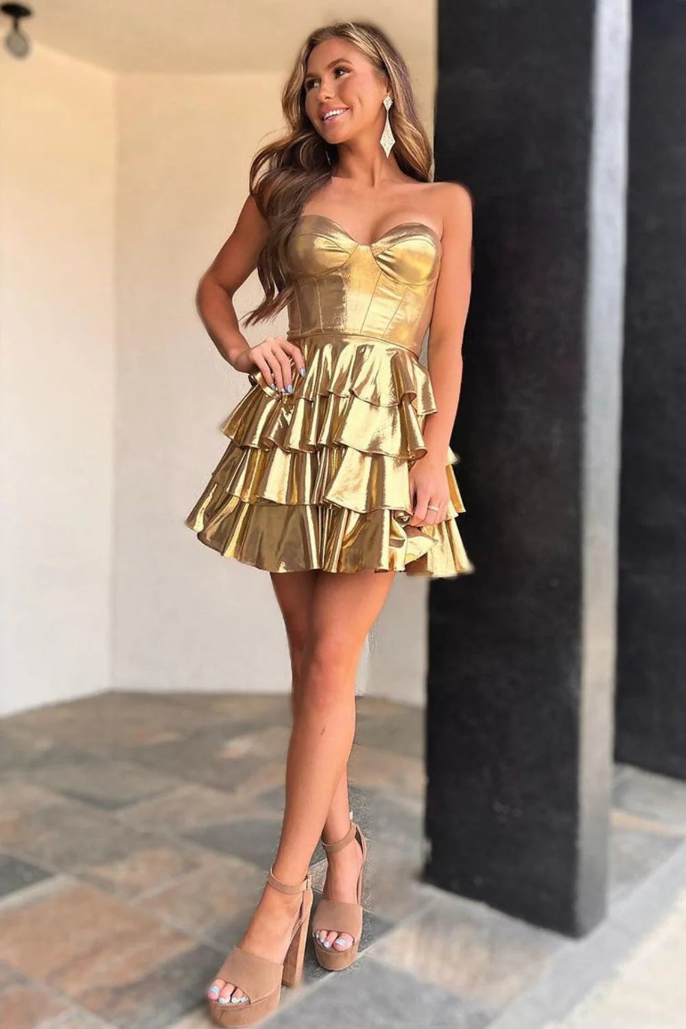 Back view of a gold A-Line sweetheart tiered metallic short homecoming dress.