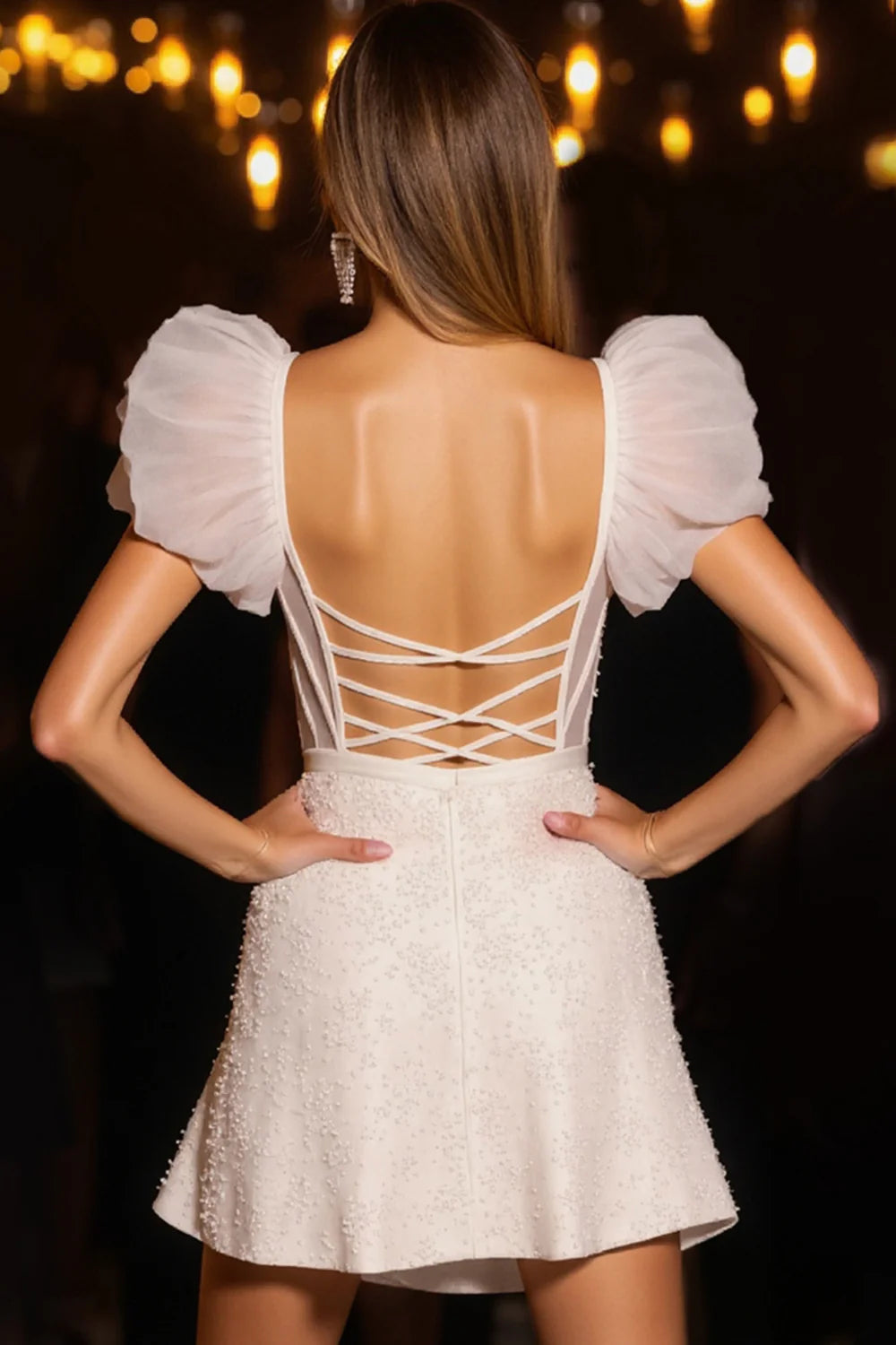 Back view of the ivory corset bodycon dress, showcasing the fitted silhouette.