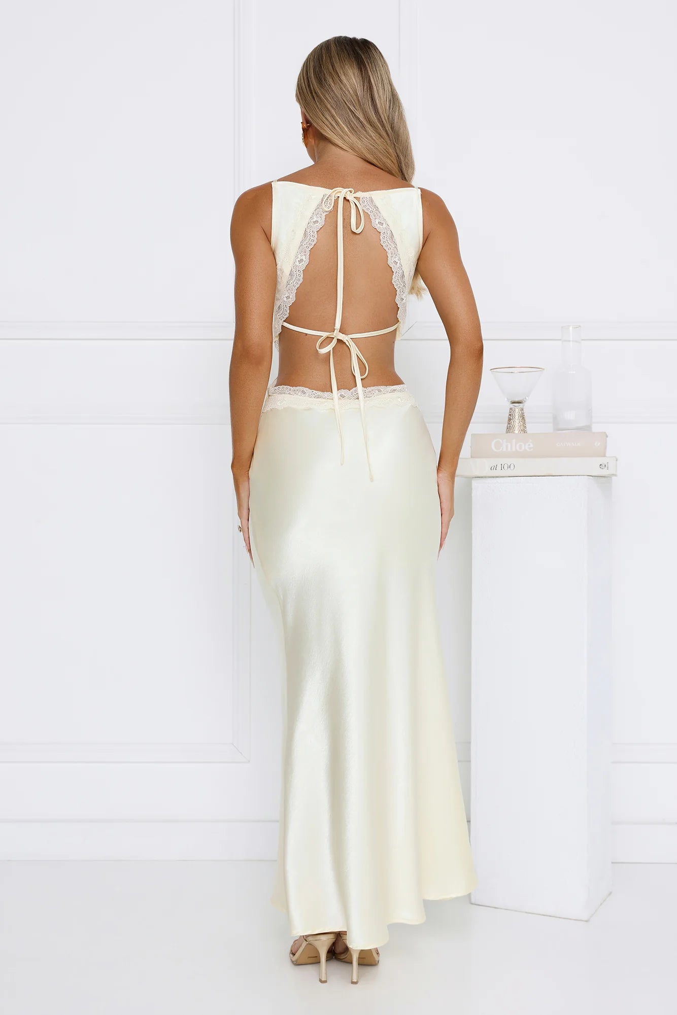Stunning Cream Satin Mermaid Maxi Dress with Cowl Neckline, Delicate Lace Trim Cutout Details, Open Back Double Tie Accent and Flowy Floor-Length Skirt