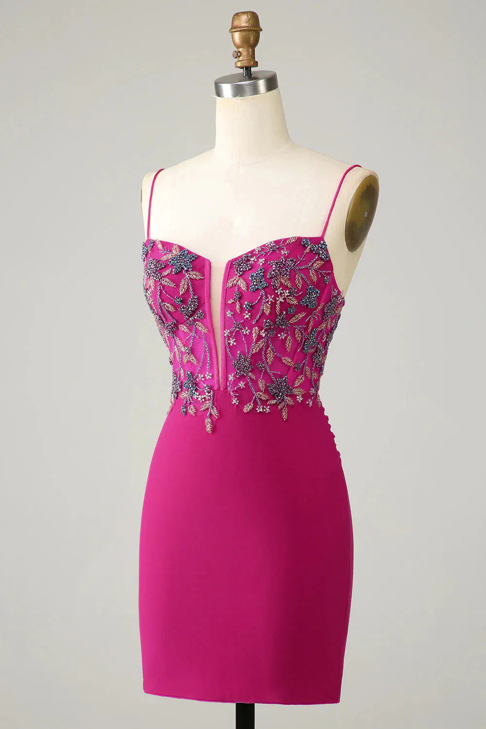 Side view of a fuchsia bodycon short homecoming dress with sparkling beading.