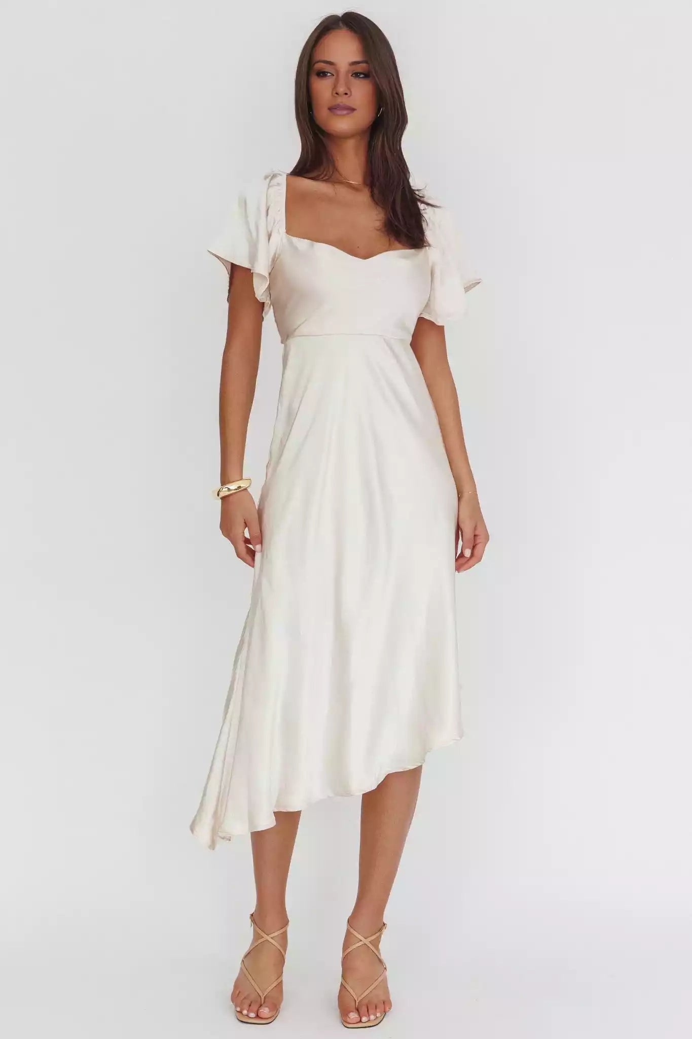 The center of attention is the mid length unlined scarf with an asymmetrical neckline and angel sleeves at the hem. The back is zippered with Prom Dresses