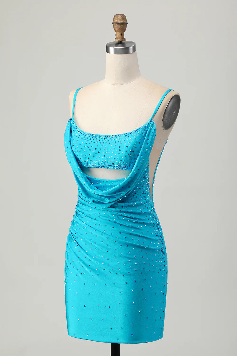 Close-up of the intricate beading and cut-out on the blue satin dress.