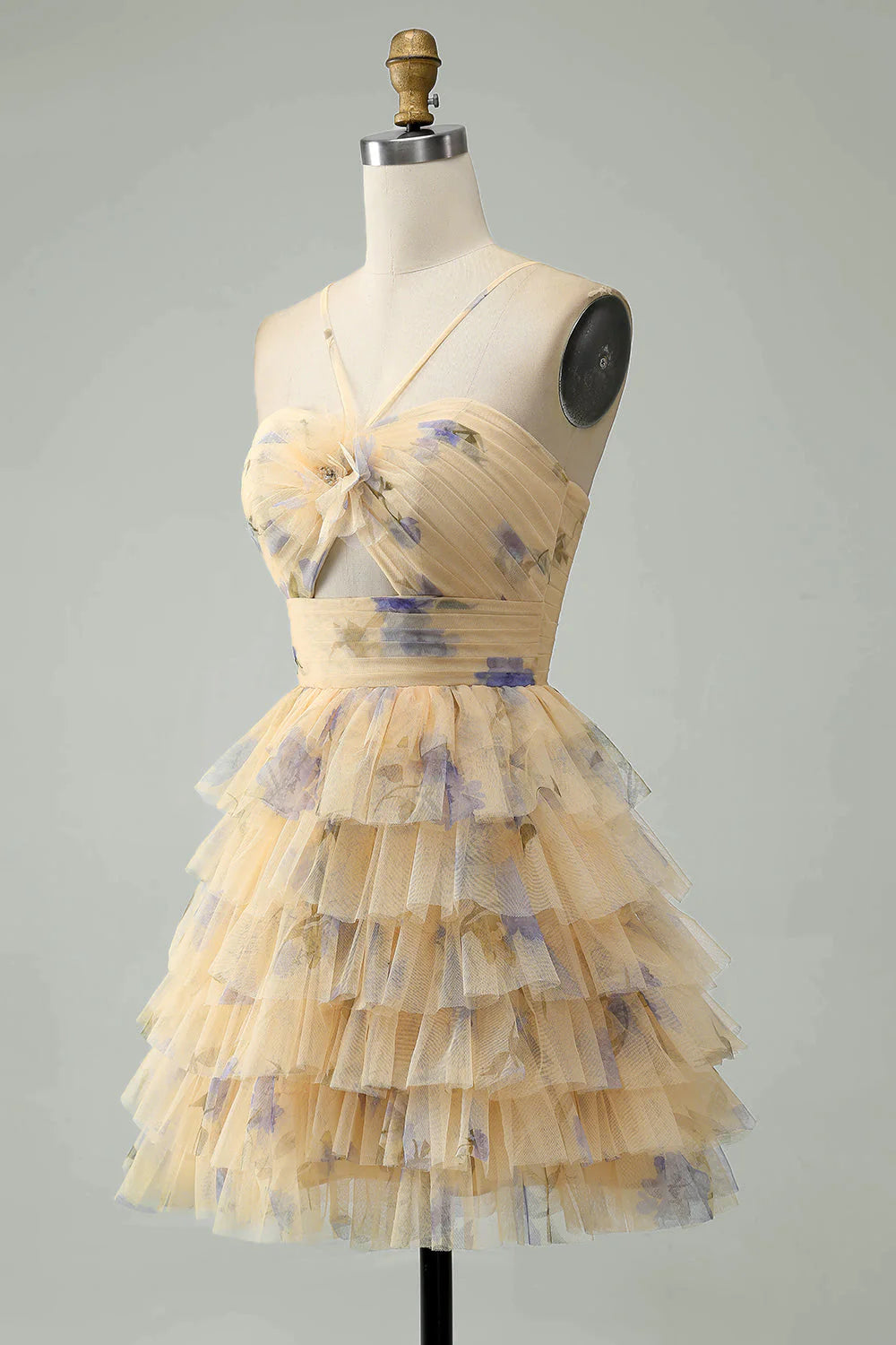 Back view of a yellow floral A-line halter tiered short dress.