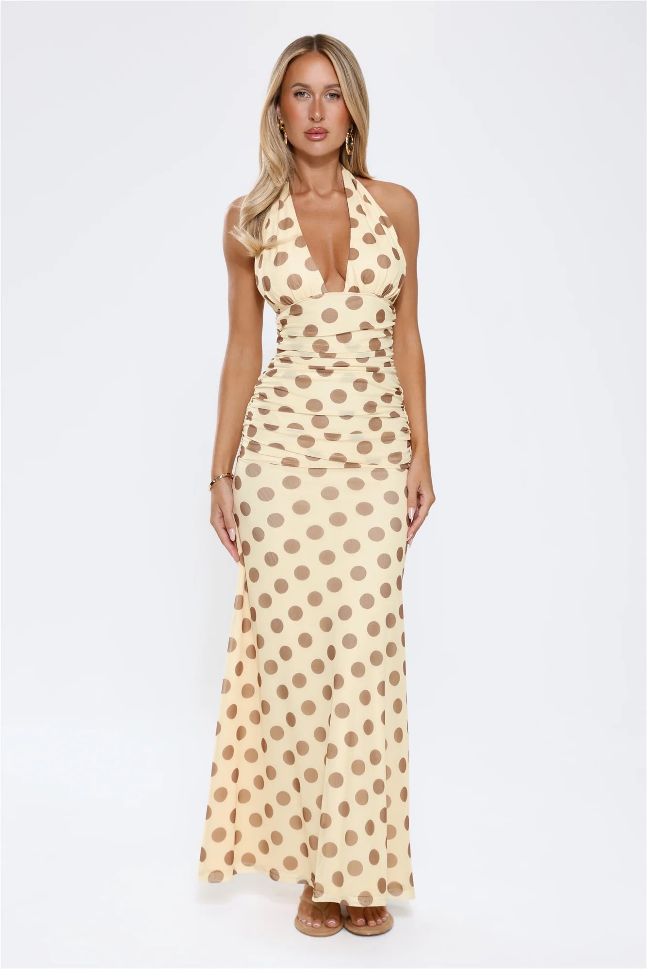 Vintage Cream Polka Dot Halter Maxi Dress with Deep V-Neckline, Ruched Waist Detail, Open Back Tie Closure and Flowing Floor-Length Skirt