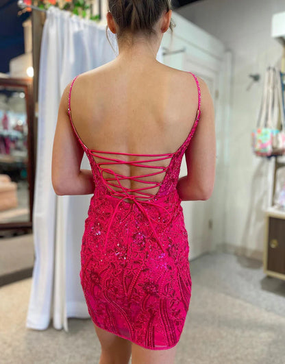 A school gown with a spaghetti strap fishbone tight corset and sparkling back