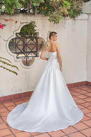 Simple sleeveless and strapless wedding dress with waist cinching and floor mopping