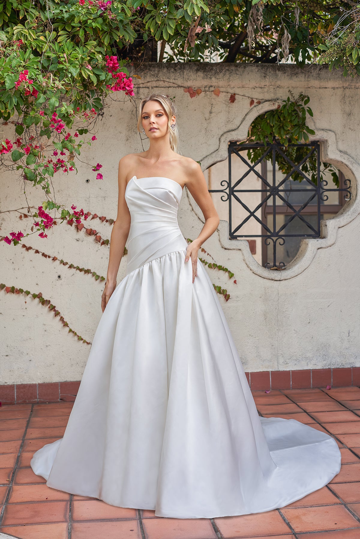 Simple sleeveless and strapless wedding dress with waist cinching and floor mopping