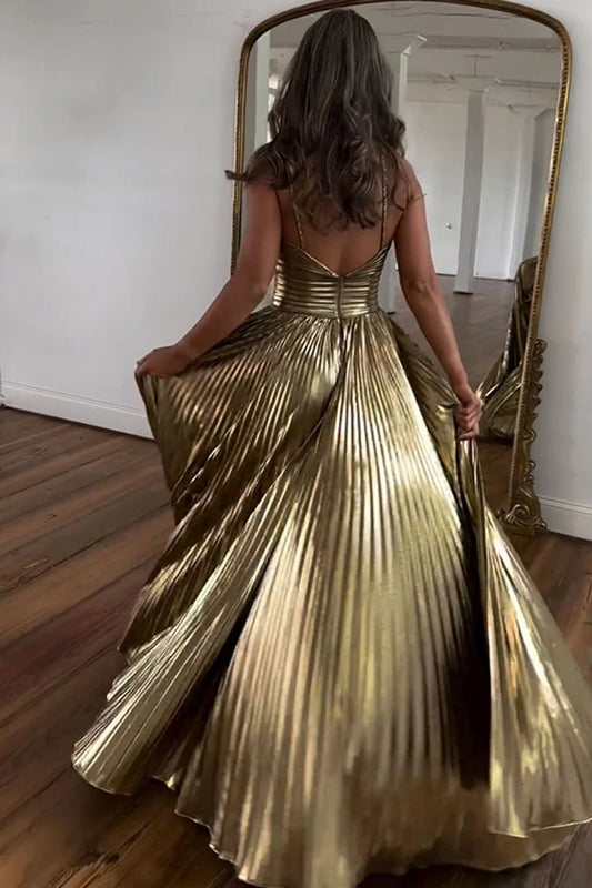 Hanging neck, exposed back, side slit, golden metal ball skirt with keyhole seam