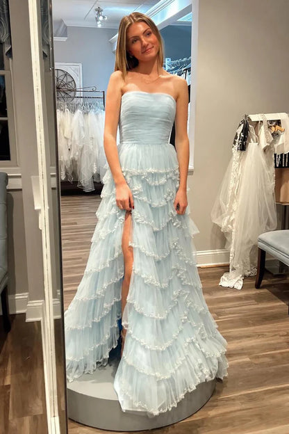 Strapless sleeveless pleated hem waist cinching side slit ballroom dress
