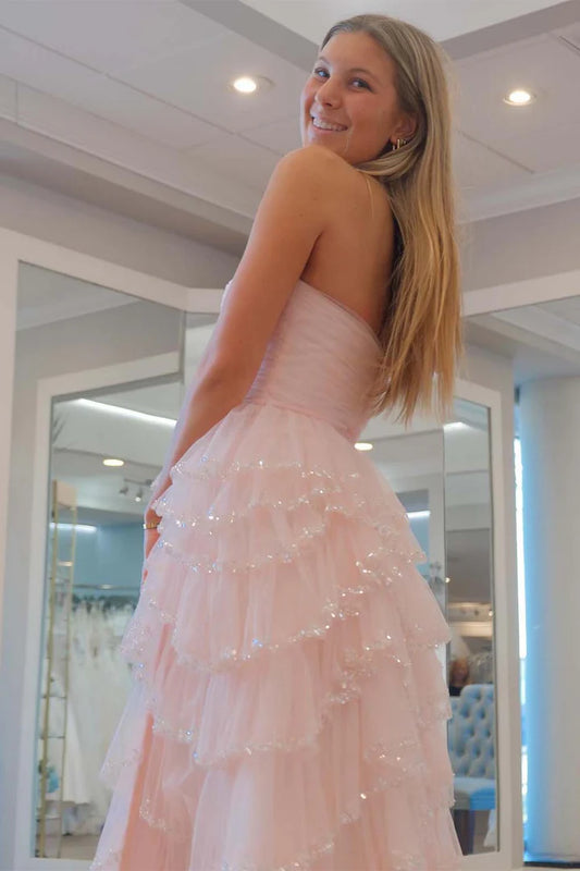 Strapless sleeveless pleated hem waist cinching side slit ballroom dress