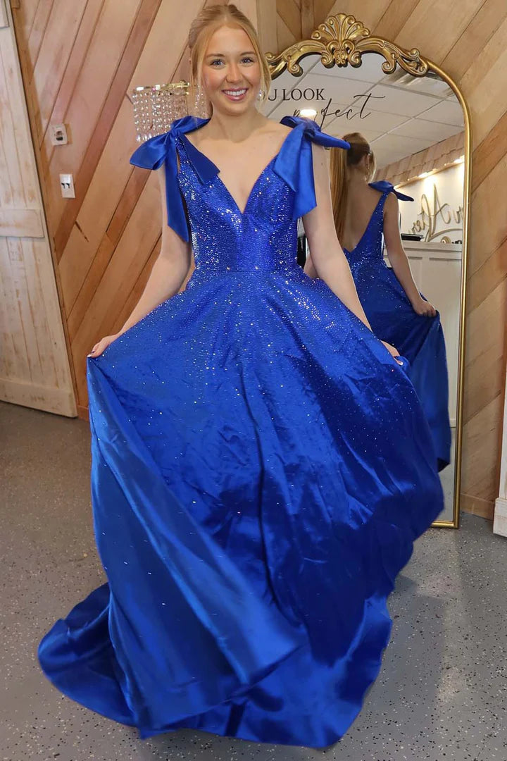 A-line beaded ball gown with suspender bow and deep V-floor skirt