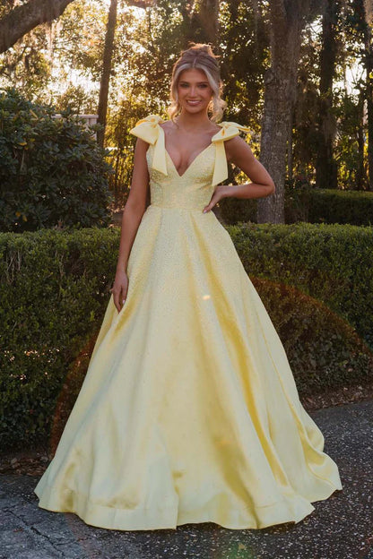 A-line beaded ball gown with suspender bow and deep V-floor skirt