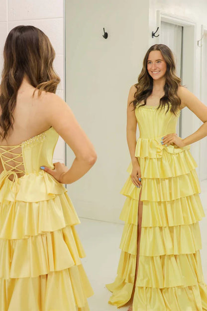 Yellow strapless ruffled side slit ball gown