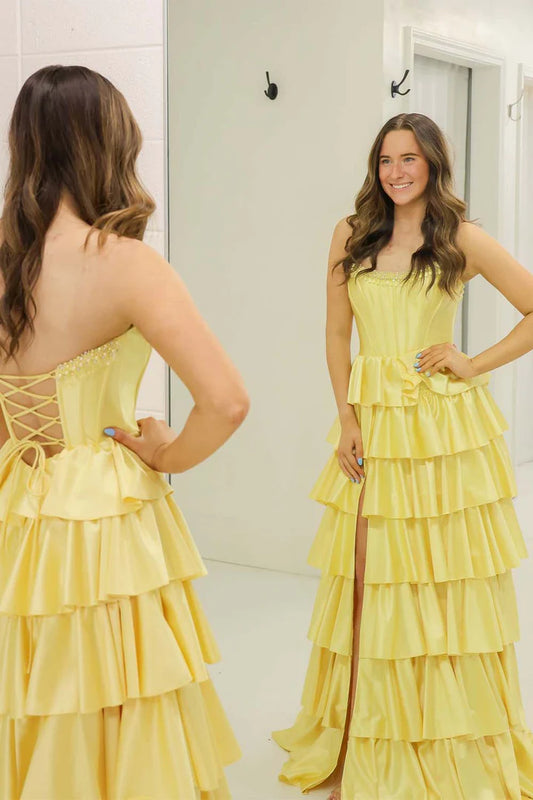 Yellow strapless ruffled side slit ball gown
