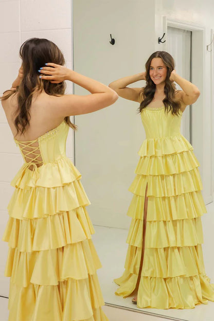 Yellow strapless ruffled side slit ball gown